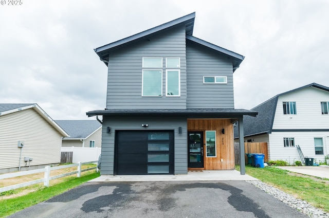 213 SE 1st Ave, Battle Ground, WA 98604 - contemporary house with driveway, a garage, and roof with shingles