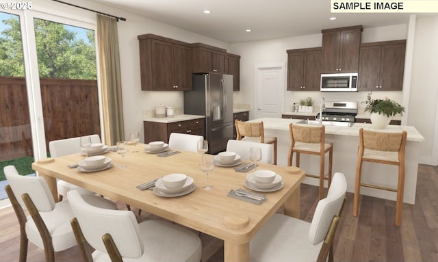 dining room featuring recessed lighting and wood finished floors