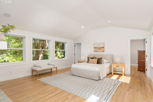 bedroom with vaulted ceiling, light wood-style flooring, baseboards, and recessed lighting