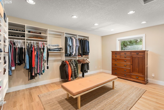 spacious closet featuring wood finished floors