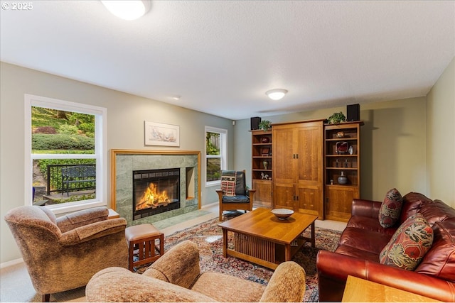 7445 SW Canyon Dr, Portland, OR 97225 - living room with healthy amount of natural light, a high end fireplace, and carpet flooring