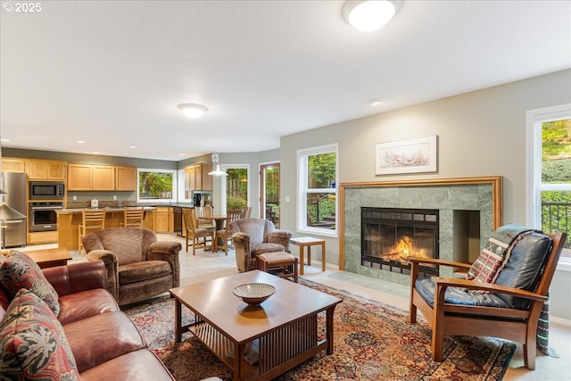 7445 SW Canyon Dr, Portland, OR 97225 - living area with plenty of natural light, a high end fireplace, and recessed lighting