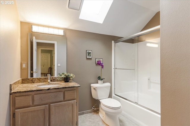 7445 SW Canyon Dr, Portland, OR 97225 - full bath featuring a skylight, vanity, combined bath / shower with glass door, and vaulted ceiling