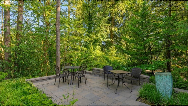 7445 SW Canyon Dr, Portland, OR 97225 - view of patio with outdoor dining area and a view of trees