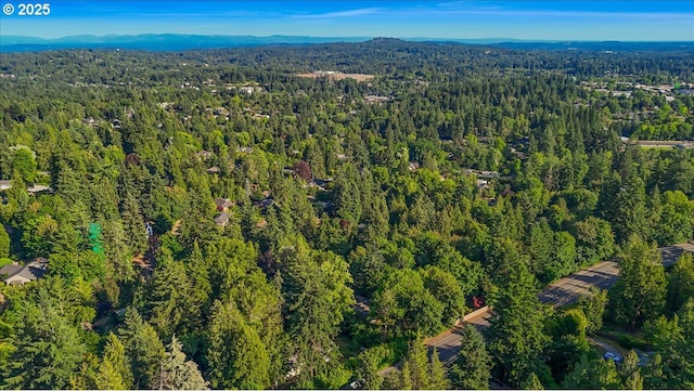 7445 SW Canyon Dr, Portland, OR 97225 - view of property location with a heavily wooded area and a mountainous background