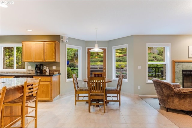7445 SW Canyon Dr, Portland, OR 97225 - dining room featuring a tiled fireplace, recessed lighting, and light tile patterned flooring