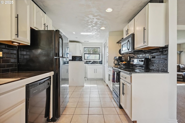 kitchen featuring recessed lighting, decorative backsplash, light tile patterned floors, black appliances, and dark countertops