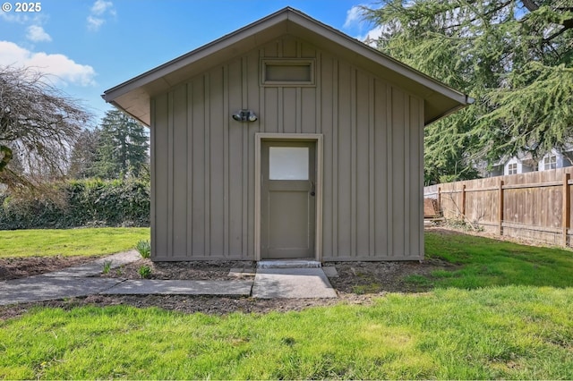 view of shed with fence