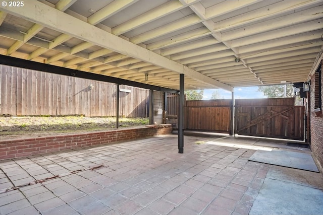 view of patio / terrace with fence and a gate
