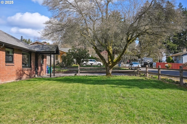 view of yard featuring fence