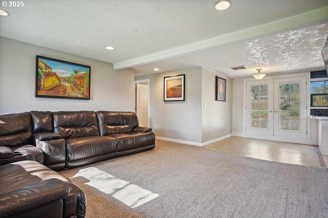 living area featuring visible vents, baseboards, recessed lighting, carpet, and french doors