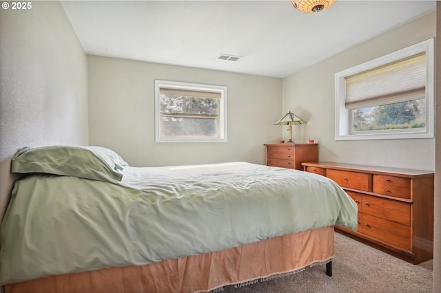 carpeted bedroom with visible vents