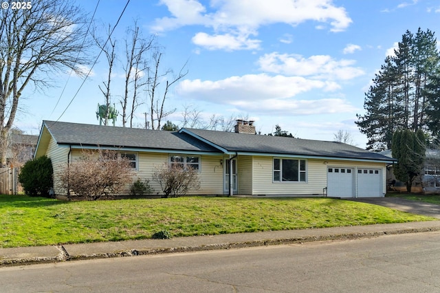 single story home featuring a garage and a front lawn