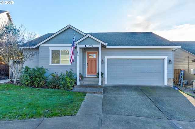 view of front facade with a front yard and a garage