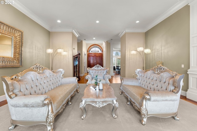 living room featuring crown molding, recessed lighting, and wood finished floors