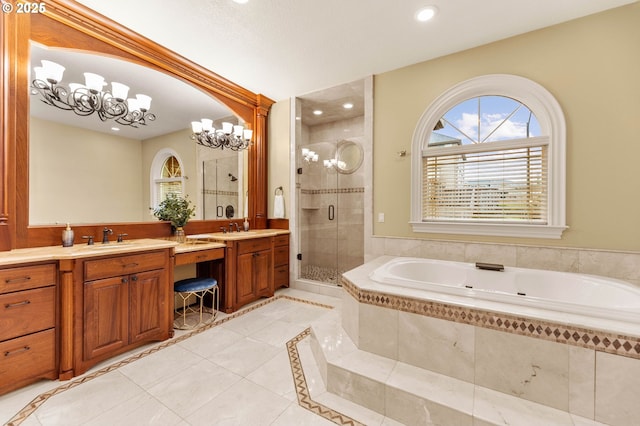 bathroom featuring double vanity, a bath, a shower stall, a sink, and tile patterned floors