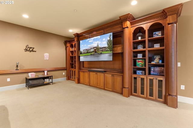 living area with recessed lighting, baseboards, and light colored carpet