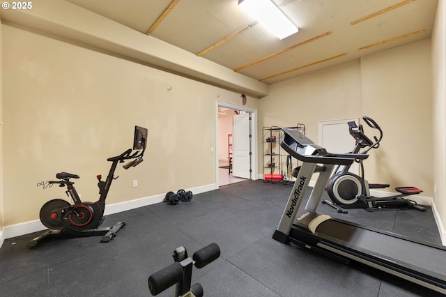 workout room with baseboards
