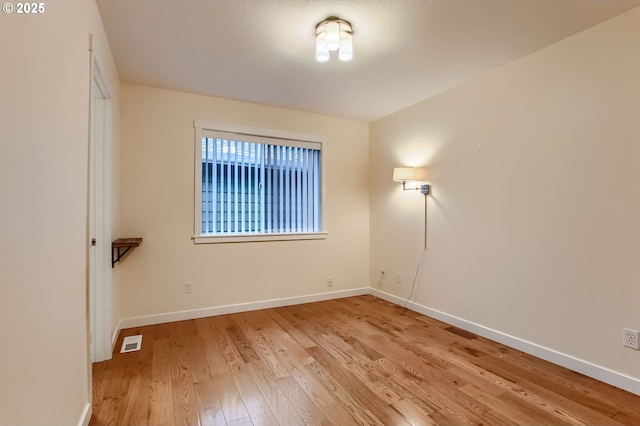 8006 SE Sporri Ln, Milwaukie, OR 97267 - unfurnished room with light wood-style flooring and baseboards