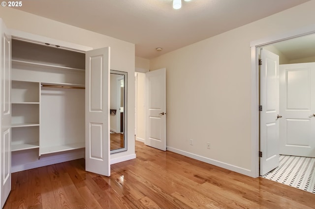 8006 SE Sporri Ln, Milwaukie, OR 97267 - unfurnished bedroom featuring baseboards, a closet, and light wood finished floors