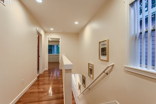 8006 SE Sporri Ln, Milwaukie, OR 97267 - corridor featuring wood finished floors, recessed lighting, baseboards, and an upstairs landing