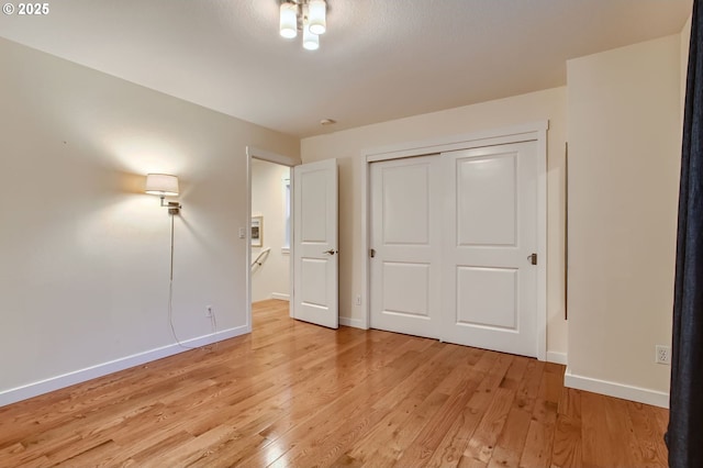 8006 SE Sporri Ln, Milwaukie, OR 97267 - unfurnished bedroom featuring baseboards, light wood finished floors, and a closet