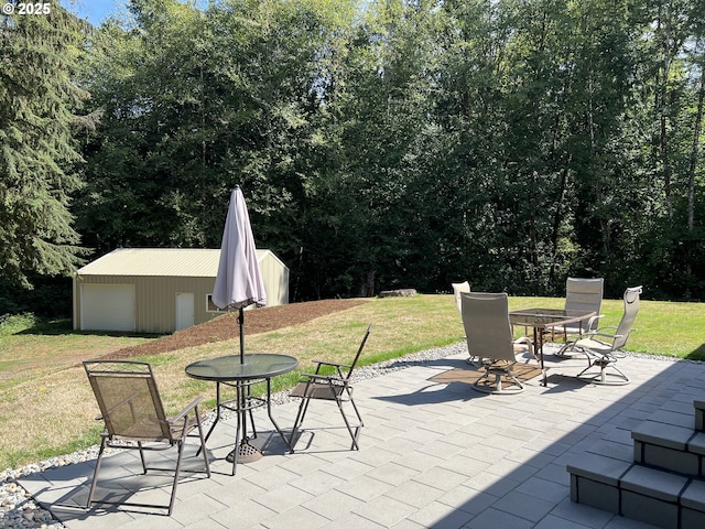 view of patio / terrace with outdoor dining area and an outdoor structure