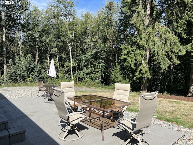 view of patio featuring outdoor dining area