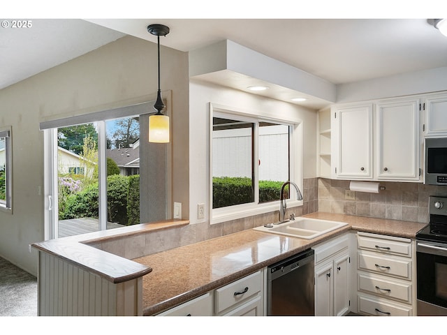 kitchen with open shelves, white cabinets, a sink, appliances with stainless steel finishes, and backsplash