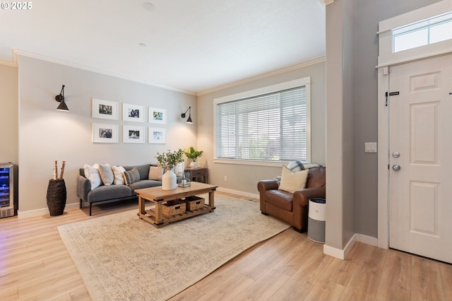 2233 NW Oxford St, Camas, WA 98607 - living room with ornamental molding, light wood finished floors, baseboards, and wine cooler
