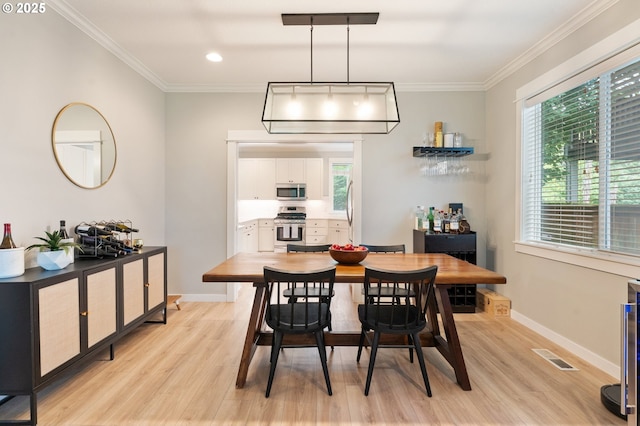 2233 NW Oxford St, Camas, WA 98607 - dining room with light wood-style flooring, ornamental molding, baseboards, and recessed lighting
