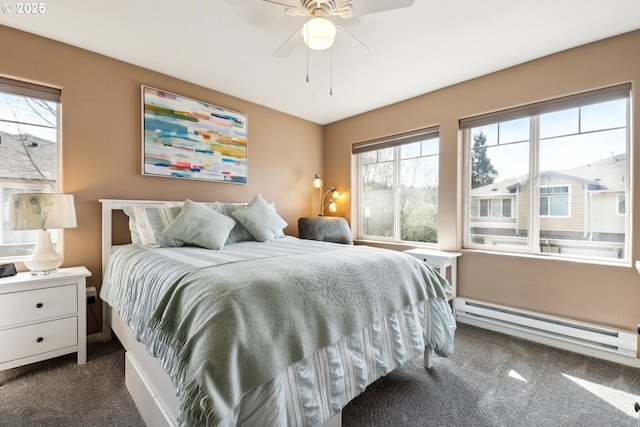 bedroom with a ceiling fan, a baseboard heating unit, and dark carpet