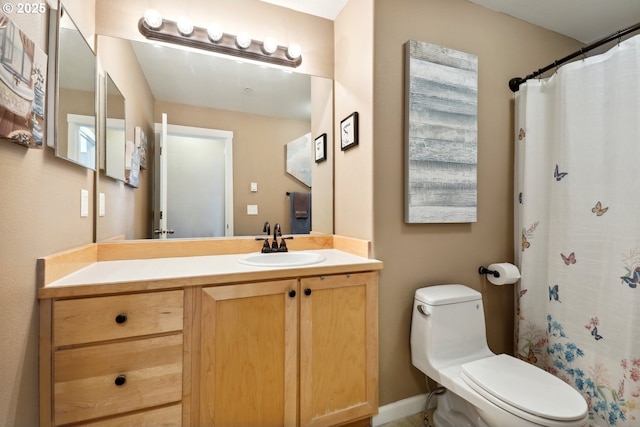 bathroom with vanity, toilet, and a shower with curtain