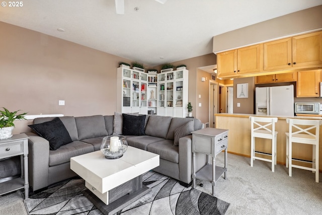 living area with light colored carpet