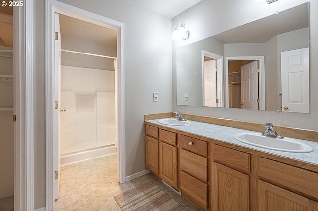 366 Pintail Ave SE, Salem, OR 97306 - full bath featuring double vanity, a spacious closet, a shower, and a sink