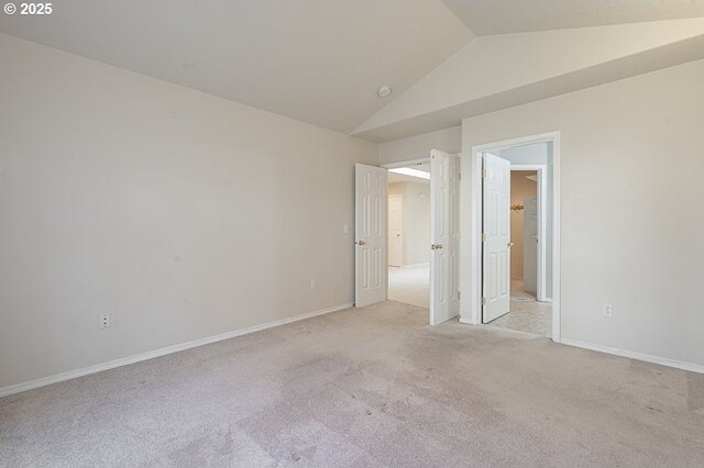 366 Pintail Ave SE, Salem, OR 97306 - unfurnished bedroom featuring baseboards, lofted ceiling, and light colored carpet
