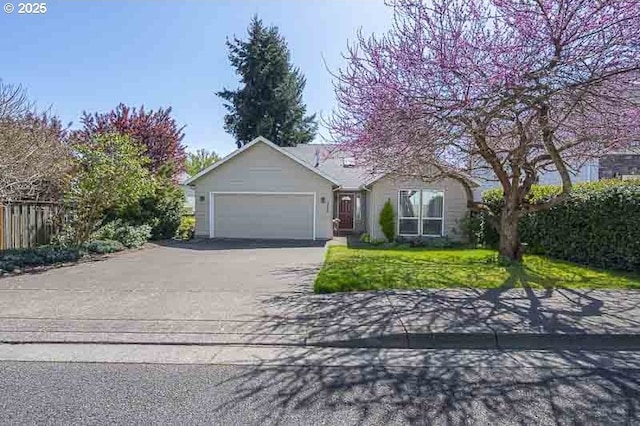 366 Pintail Ave SE, Salem, OR 97306 - ranch-style house with a front lawn, aphalt driveway, an attached garage, fence, and stucco siding
