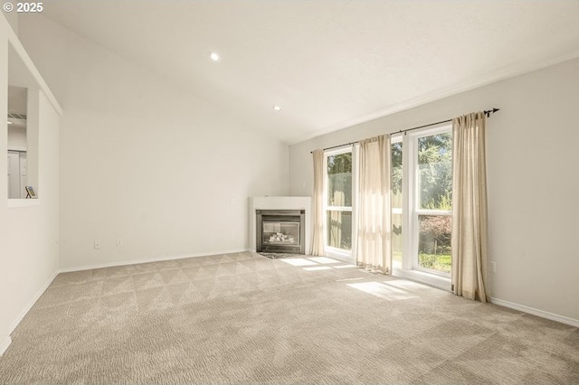 366 Pintail Ave SE, Salem, OR 97306 - unfurnished living room with a fireplace with flush hearth, baseboards, recessed lighting, and light colored carpet