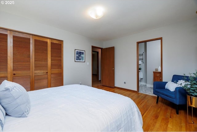 15 SW 95th Ave, Portland, OR 97225 - bedroom with a closet, wood finished floors, and ensuite bath
