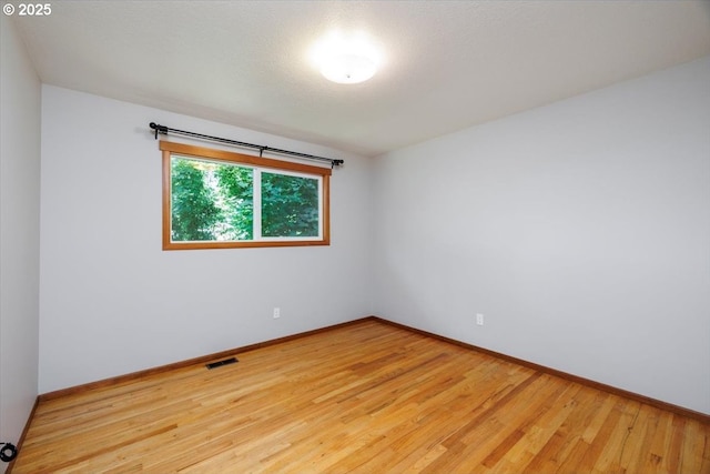 15 SW 95th Ave, Portland, OR 97225 - spare room with baseboards and light wood-style flooring