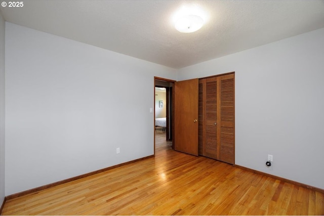 15 SW 95th Ave, Portland, OR 97225 - unfurnished bedroom featuring a closet, light wood-style flooring, and baseboards