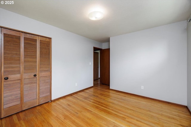 15 SW 95th Ave, Portland, OR 97225 - unfurnished bedroom featuring light wood-style flooring, baseboards, and a closet
