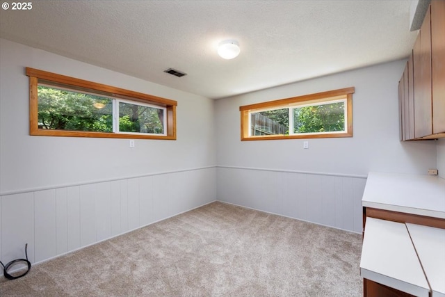 15 SW 95th Ave, Portland, OR 97225 - carpeted empty room with healthy amount of natural light and wainscoting