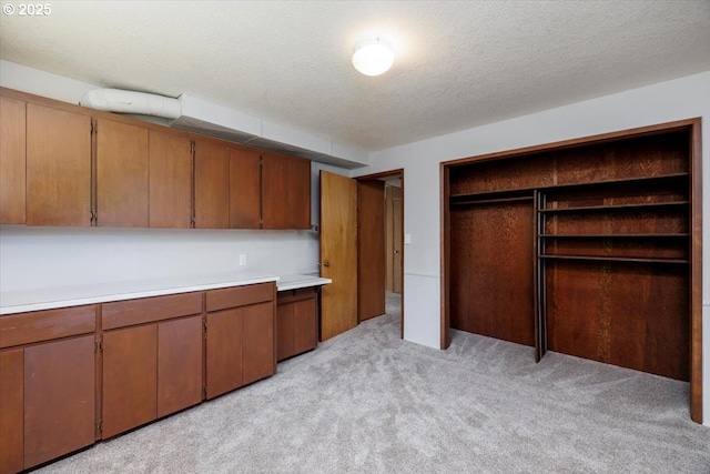 15 SW 95th Ave, Portland, OR 97225 - kitchen with light colored carpet, light countertops, brown cabinets, and open shelves