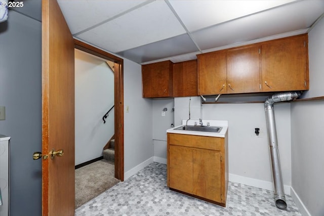 15 SW 95th Ave, Portland, OR 97225 - laundry area with cabinet space, light flooring, and baseboards
