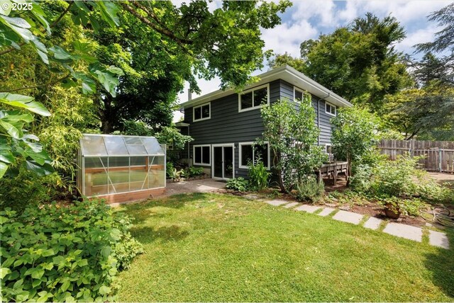 15 SW 95th Ave, Portland, OR 97225 - rear view of house with a greenhouse and an outbuilding
