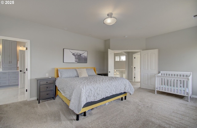 bedroom with light carpet, visible vents, and baseboards