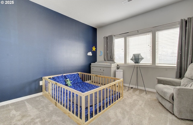 bedroom featuring light colored carpet, visible vents, and baseboards