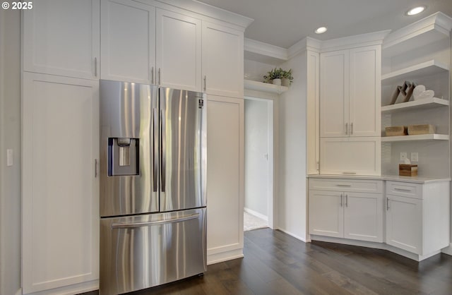 kitchen featuring dark wood finished floors, light countertops, stainless steel refrigerator with ice dispenser, white cabinetry, and open shelves