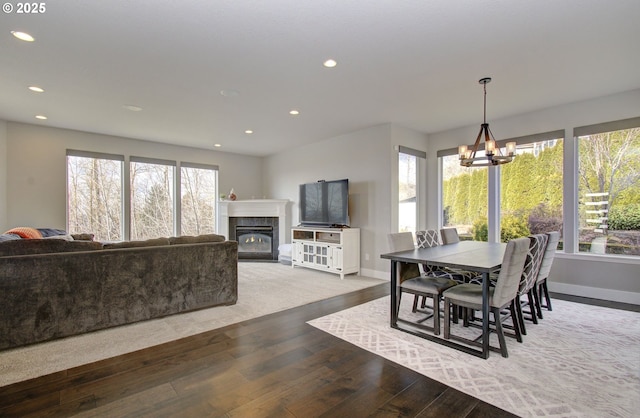 dining area featuring hardwood / wood-style floors, a wealth of natural light, and recessed lighting